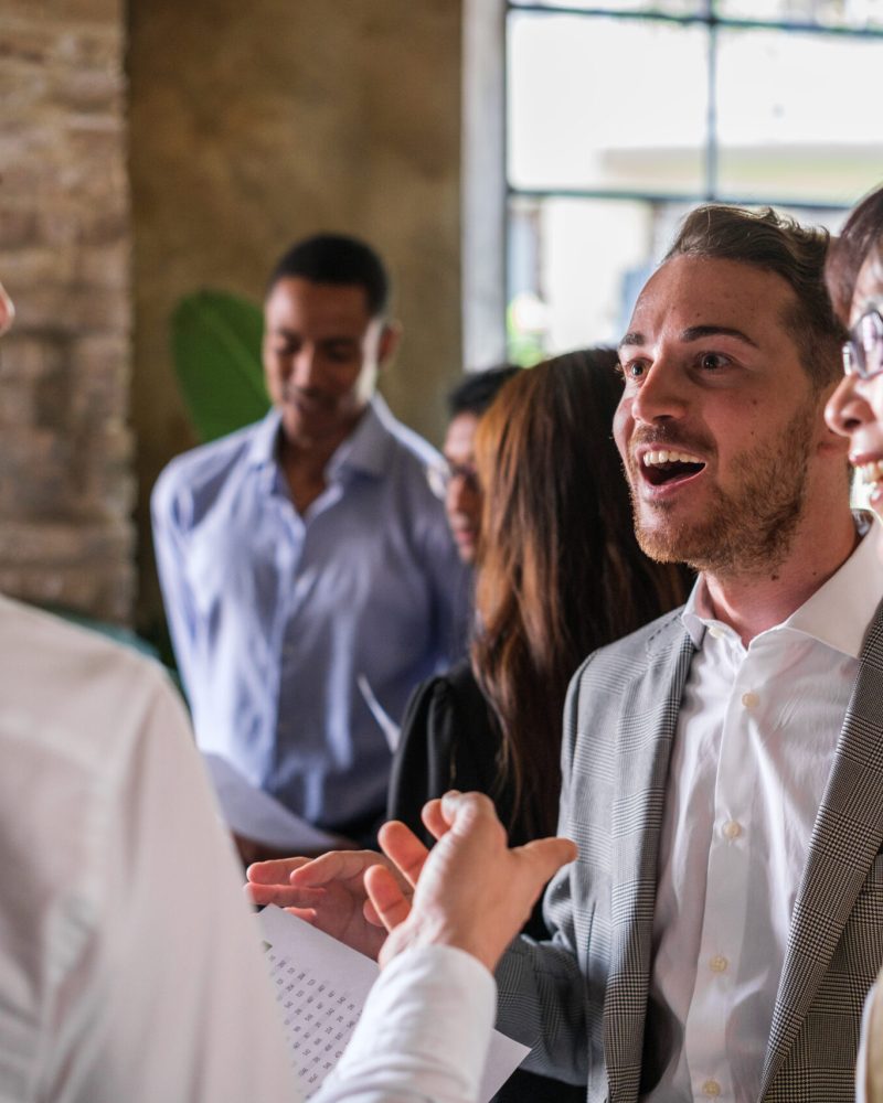 Co-workers arguing standing up to improve the economic results of the company
